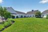 Beautifully maintained community grounds offer open green space, outdoor seating, and a welcoming neighborhood atmosphere.