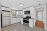Unit #2-Well-appointed kitchen blending style and practicality.