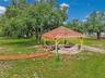 Tiki hut provides a super spot to grill and relax in a hammock
