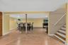 Spacious lower-level family room provides additional space to relax, gather, and entertain