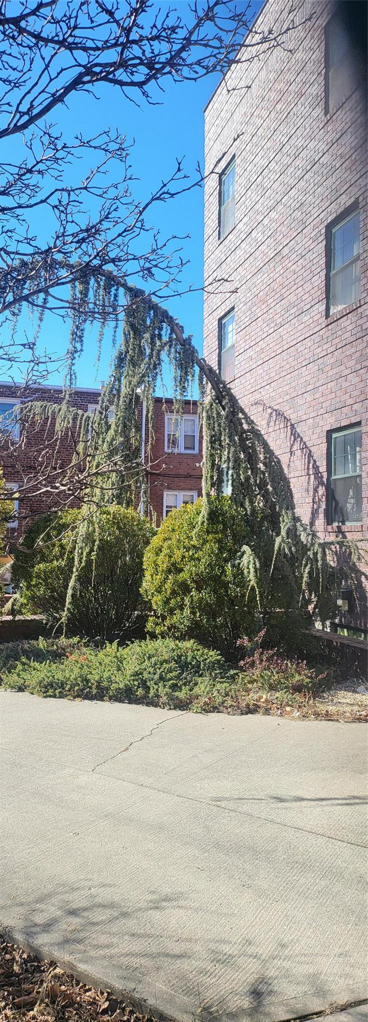 View of side of property featuring brick siding