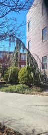 View of side of property featuring brick siding