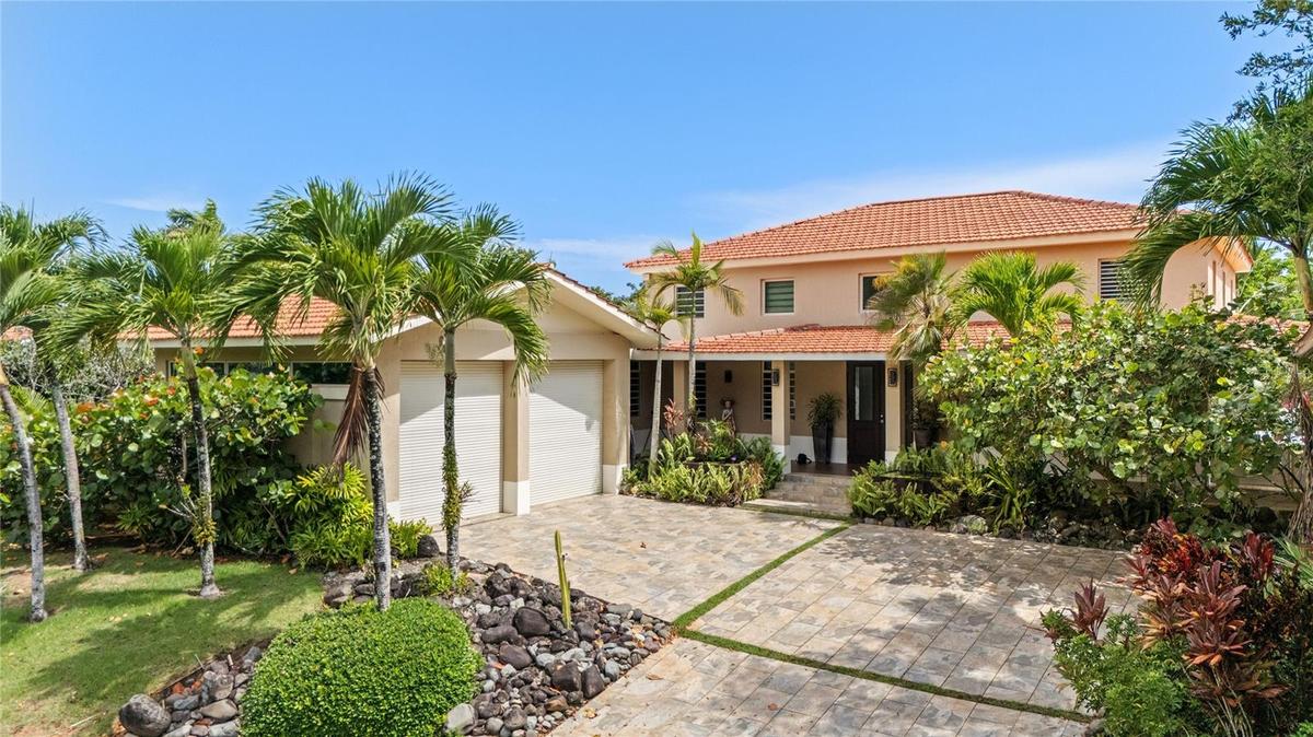 Nestled within the highly sought-after gated community of Sabanera Dorado, this exceptional Carbia model sits on one of the neighborhood's most desira