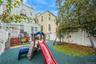 View of play area with a fenced backyard