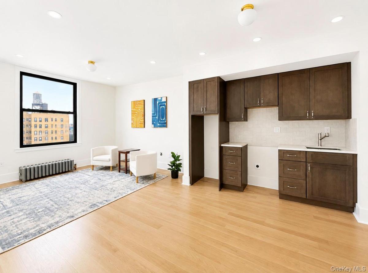 Open concept kitchen and living room. Extra wide window with water view