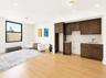 Open concept kitchen and living room. Extra wide window with water view