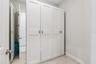Primary Owners Suite Walk-In Closet