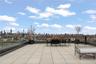 View of patio with a skyline view and outdoor dining space