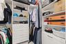 The primary bedroom offers "his and hers" walk-in closets.