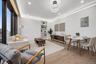 Living room with electric panel, light wood-type flooring, recessed lighting, baseboards, and built in shelves