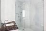 Full bath with a stall shower and vanity