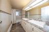 One of 2 full bathrooms-updated with double sinks and tub.