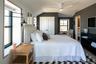 Bedroom featuring vaulted ceiling, a closet, and ceiling fan