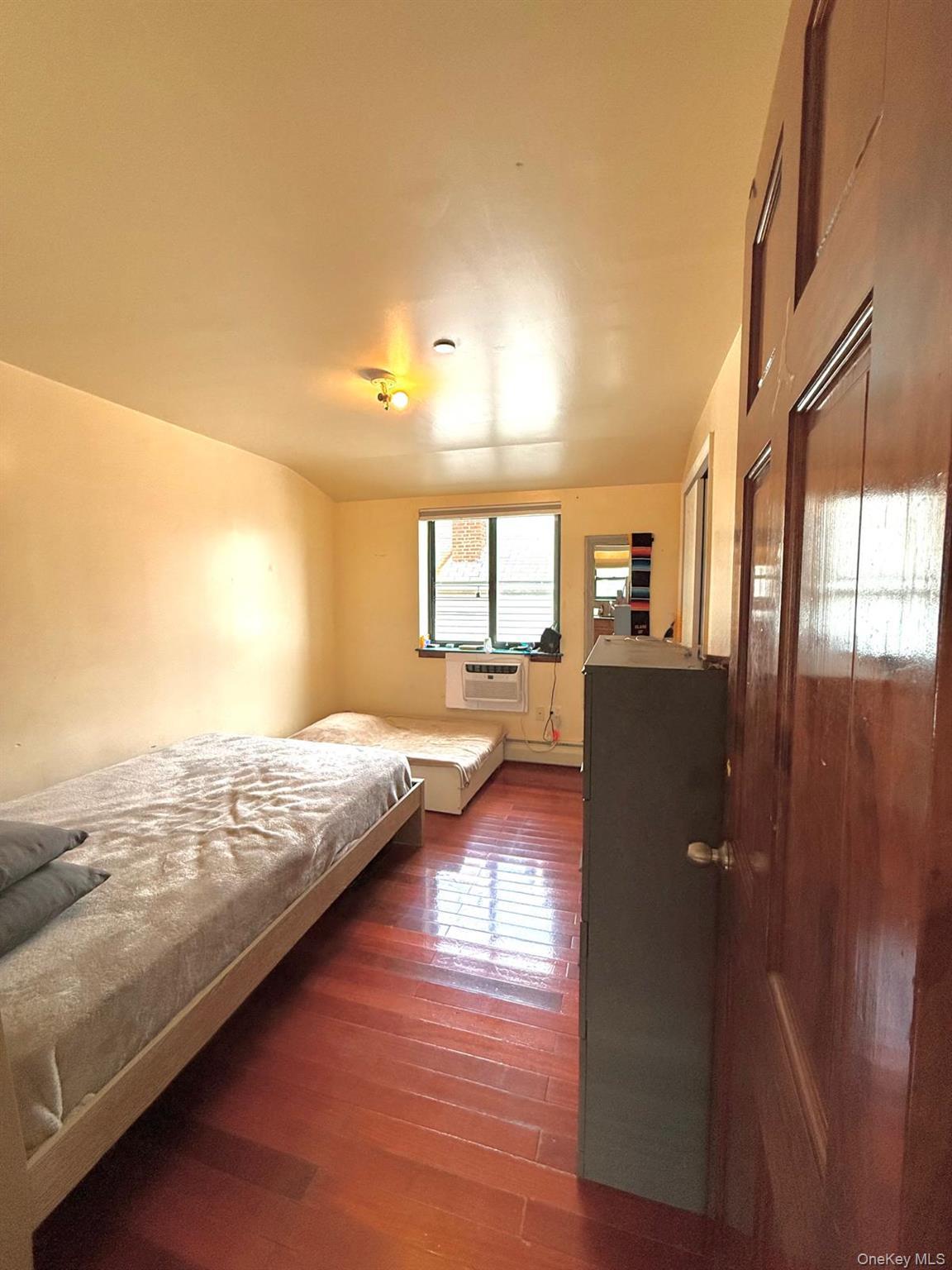 Bedroom featuring dark wood-style floors