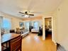 4 - Bedroom with light wood-style flooring, baseboards, and ceiling fan