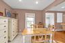 Dining area with a baseboard radiator, recessed lighting, and light tile patterned flooring