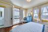primary bedroom with half bath & private balcony
