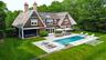 Generous lawn extending beyond the pool