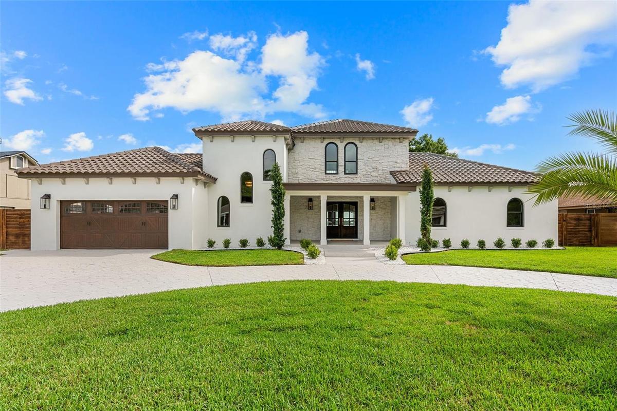IMPRESSIVE FRONT ELEVATION SHOWCASING THE ESTATE