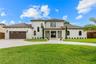 IMPRESSIVE FRONT ELEVATION SHOWCASING THE ESTATE