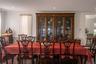 Expansive dining room between the front living room and large farmhouse kitchen behind.  Floors are amazing and the updates keep the original wood det