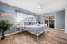 Primary bedroom just steps from the pool