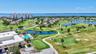 Aerial View of Club Golf Course and Bay Club Building