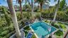 Private tropical pool overlooking canal