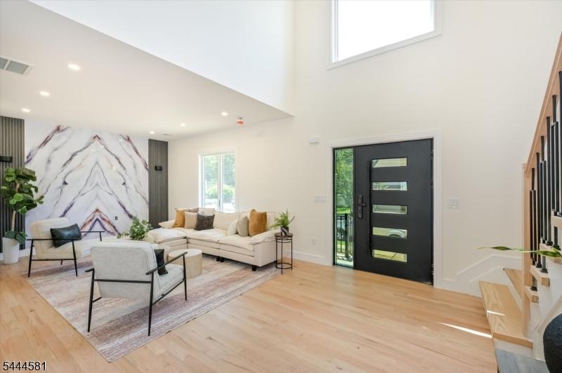 Two story entry foyer view, g