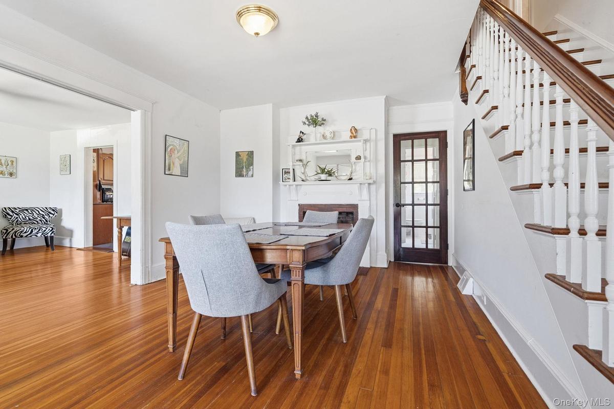 Perfectly positioned at the center of the home, the dining room offers effortless flow, a stunning decorative fireplace, and ample space for entertain
