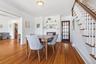Perfectly positioned at the center of the home, the dining room offers effortless flow, a stunning decorative fireplace, and ample space for entertain