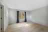 Empty room with light hardwood / wood-style floors