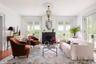 Living area with french doors, plenty of natural light, and crown molding