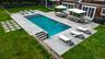 Expansive bluestone patio and resort style pool area