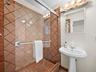 Adjacent guest bathroom located privately in the guest wing.