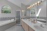 Bathroom featuring a built-in tub, separate shower enclosure, and a double vanity with two sinks