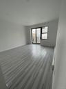 Empty room with baseboards and wood finished floors