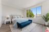 Bedroom featuring wood-style f