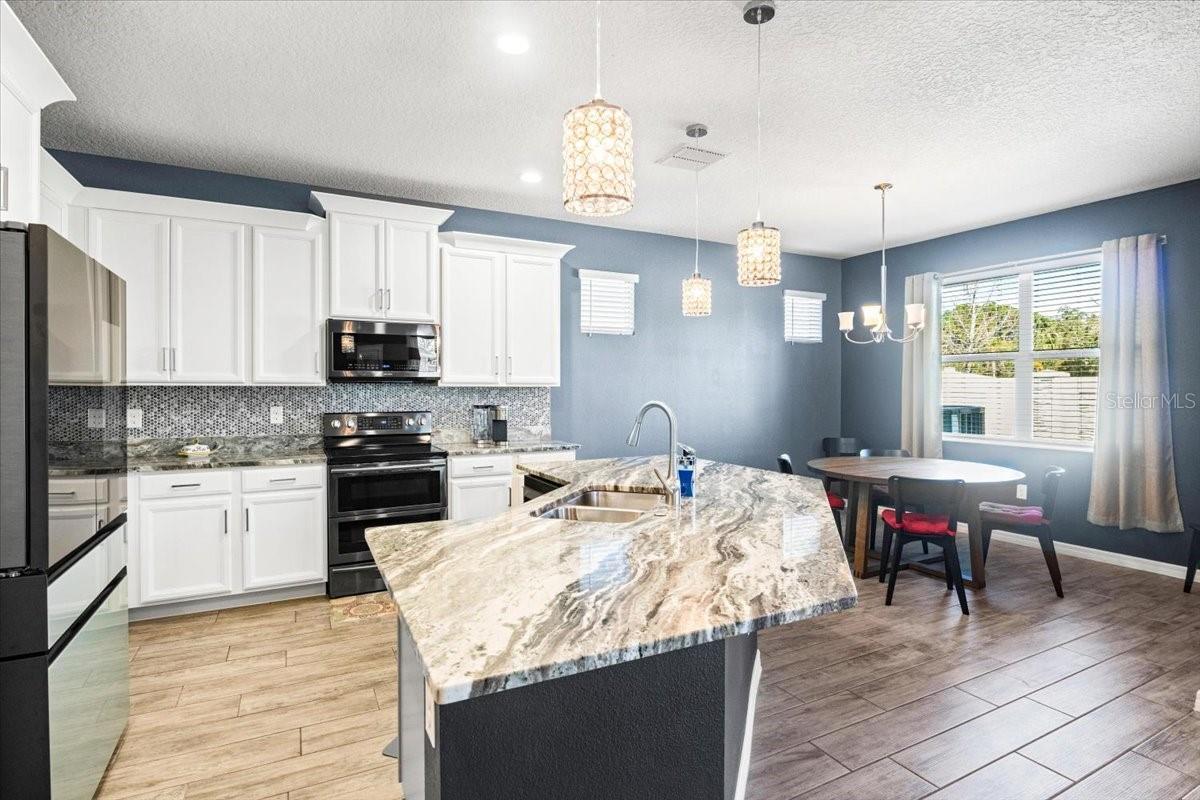 Large kitchen with center island and dining area