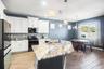 Large kitchen with center island and dining area