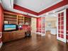 Office with access to living room and kitchen