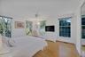 Primary ensuite bedroom with parklike views