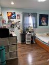 Bedroom featuring dark wood-type flooring