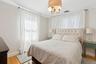 Bedroom featuring light wood-style flooring and a chandelier
