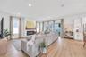 Inviting open concept living room centered around beautiful gas fireplace, perfect for every day living