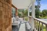 Balcony with view of wooded area
