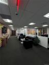 Common area with a paneled ceiling and a surveillance system