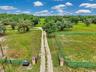 100x200 grass riding arena on the right and an exercise paddock behind it