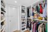 Walk through this aweosme closet to get to the en suite bathroom