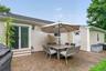 Private backyard with patio, perfect for outdoor dining, relaxing, and entertaining.